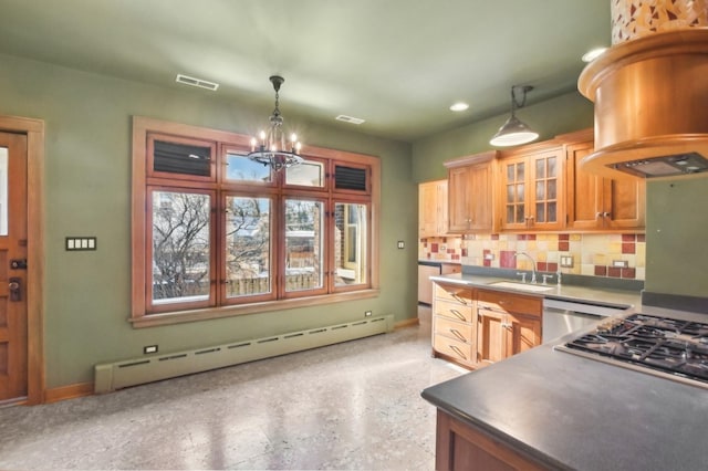 kitchen with island range hood, decorative light fixtures, stainless steel appliances, decorative backsplash, and a baseboard heating unit