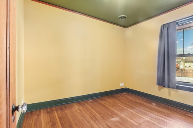 unfurnished room featuring wood-type flooring