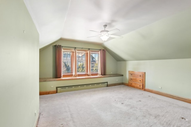 bonus room with vaulted ceiling, light colored carpet, ceiling fan, and baseboard heating