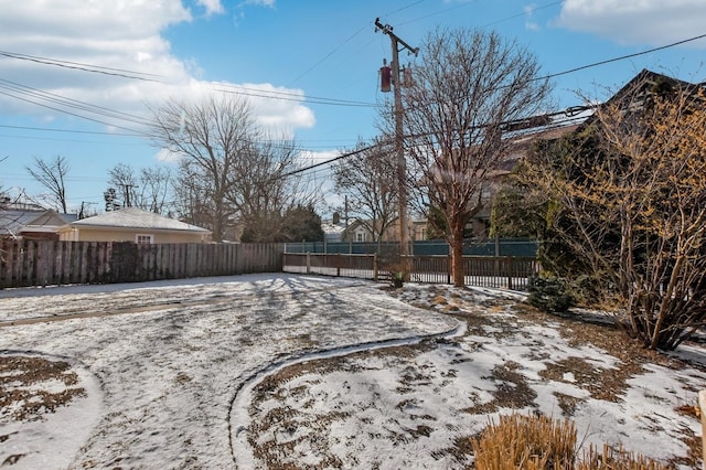 view of yard layered in snow