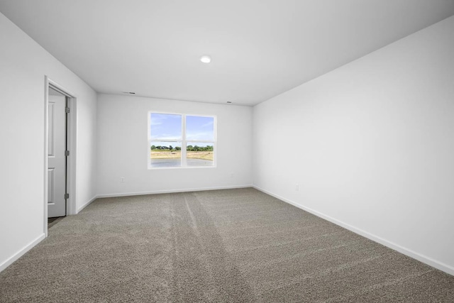 unfurnished room featuring carpet