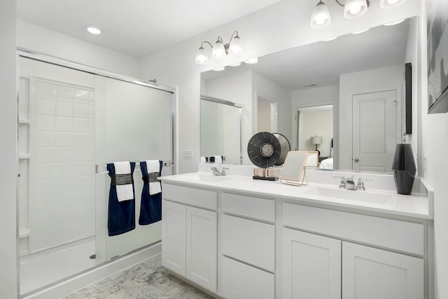 bathroom with an enclosed shower and vanity