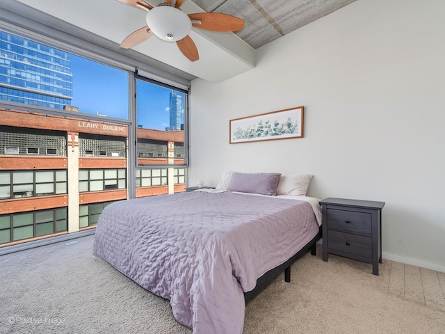 bedroom featuring light carpet and ceiling fan