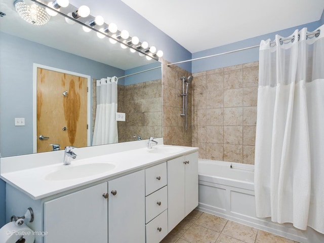 bathroom with shower / tub combo, tile patterned floors, and vanity