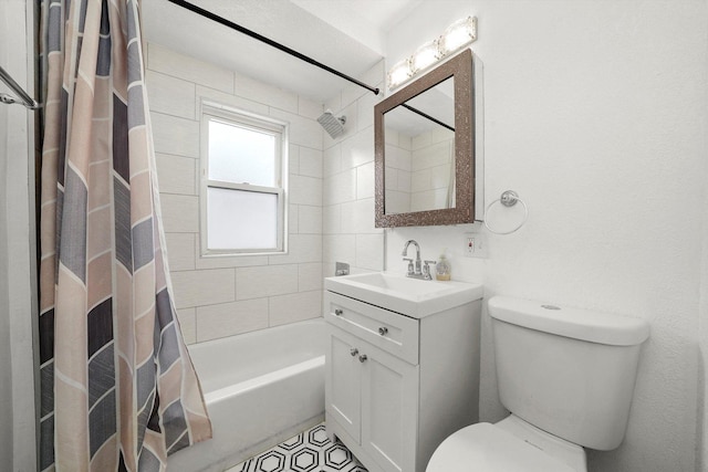 full bathroom featuring toilet, shower / tub combo, and vanity