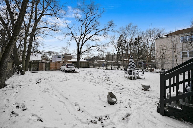 view of yard layered in snow