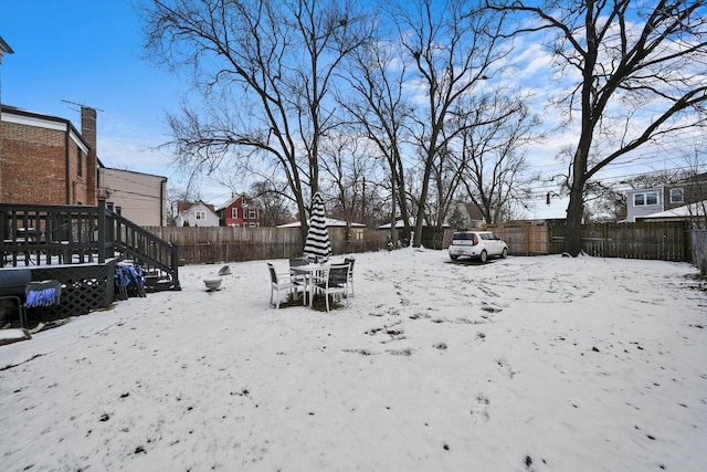 view of yard covered in snow