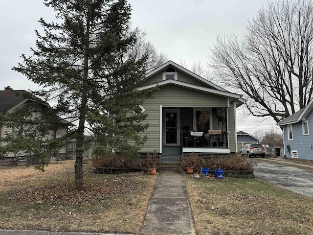 bungalow-style home with a porch