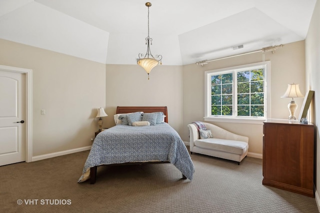 carpeted bedroom with baseboards, vaulted ceiling, and visible vents