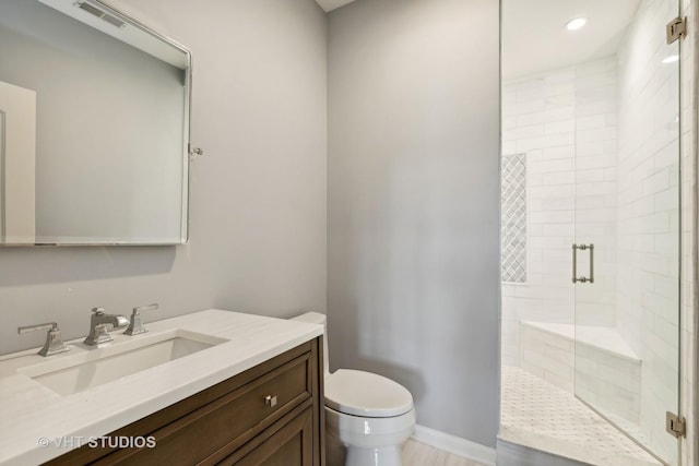 bathroom featuring visible vents, a shower stall, vanity, toilet, and recessed lighting