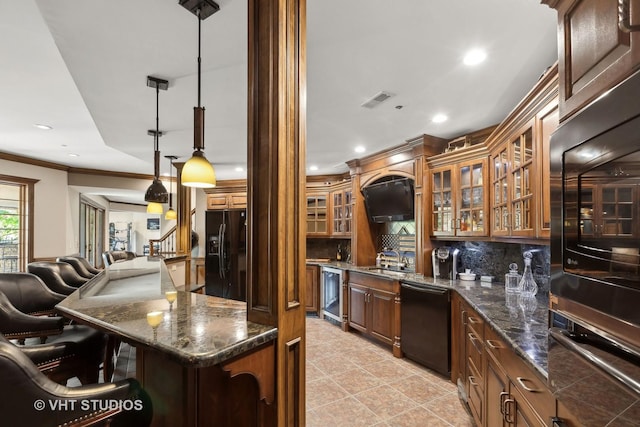 kitchen featuring visible vents, decorative backsplash, wine cooler, a kitchen bar, and black appliances