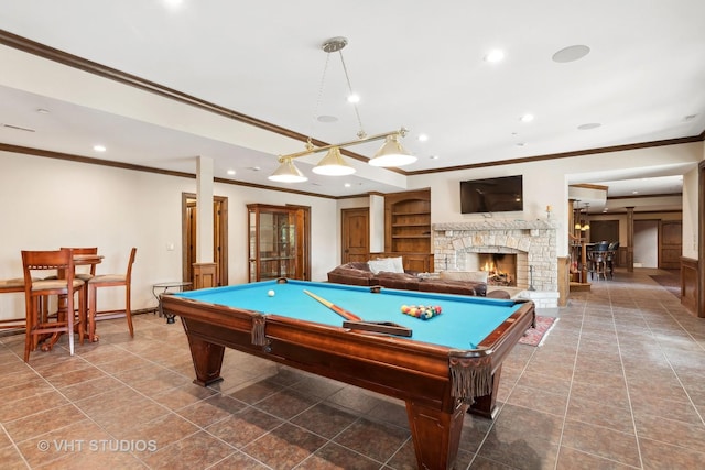 playroom featuring crown molding, billiards, and a fireplace