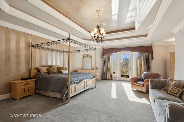 bedroom featuring an inviting chandelier, ornamental molding, access to outside, a tray ceiling, and carpet