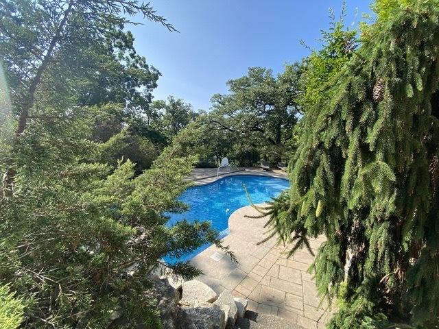outdoor pool featuring a patio area