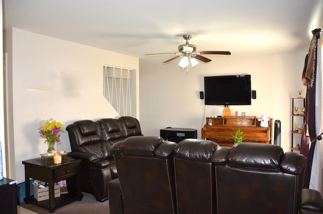 living room featuring ceiling fan and carpet floors