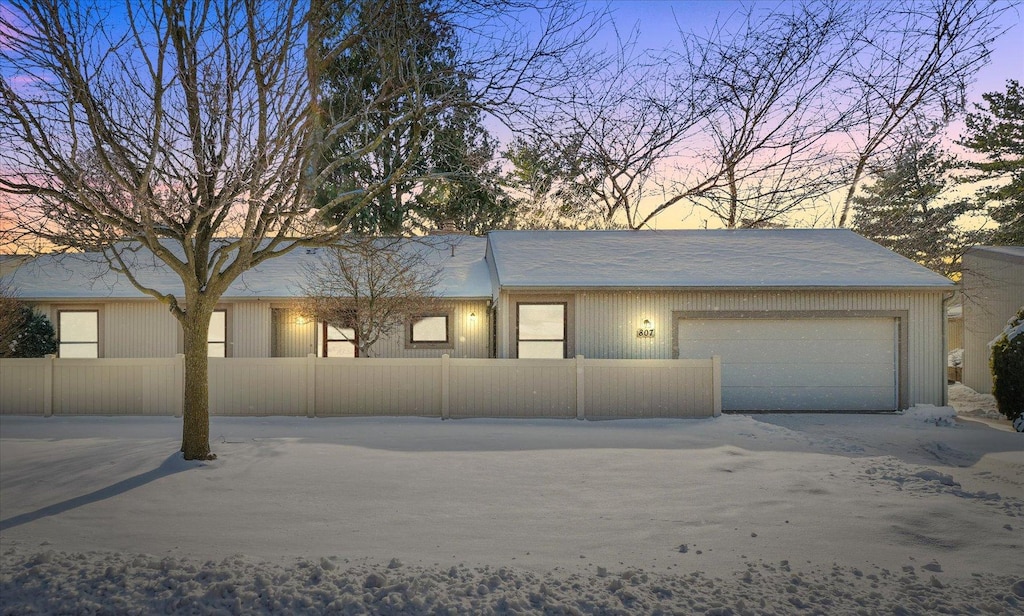 ranch-style home featuring a garage