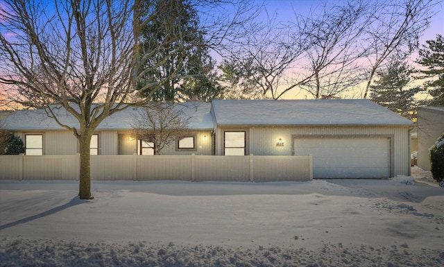 ranch-style home featuring a garage