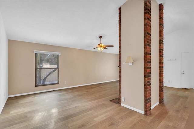 unfurnished living room featuring lofted ceiling, ceiling fan, and light hardwood / wood-style floors