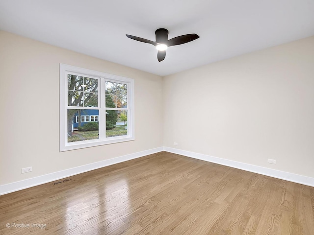 spare room with ceiling fan and light hardwood / wood-style flooring