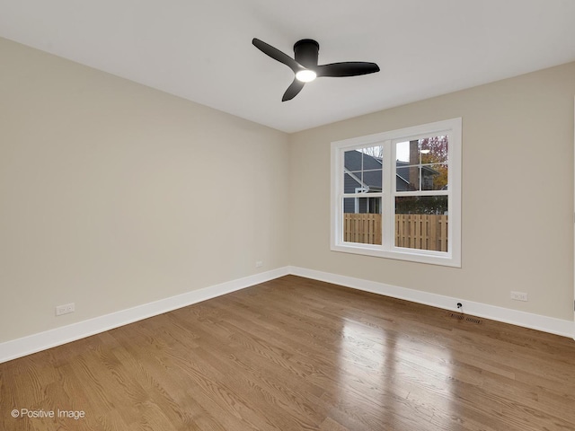 unfurnished room with ceiling fan and light hardwood / wood-style floors