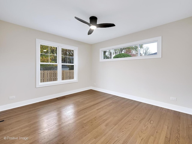 unfurnished room with ceiling fan and light hardwood / wood-style flooring