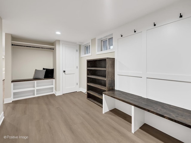 mudroom with light hardwood / wood-style floors