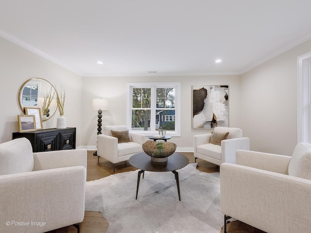 living room with ornamental molding and wood-type flooring