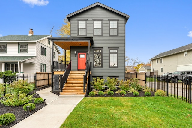 view of front of home featuring a front lawn