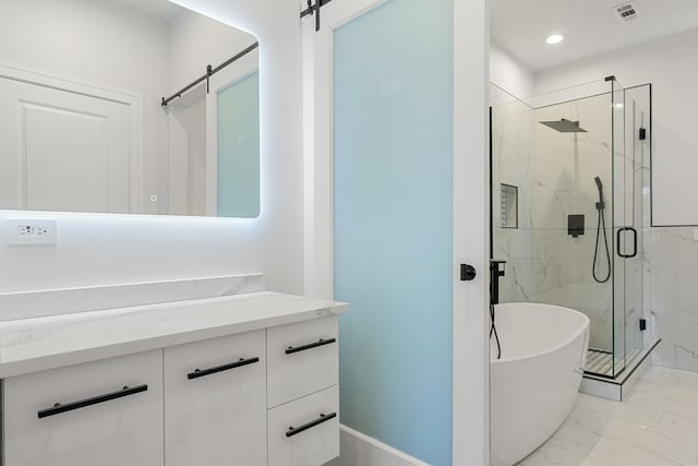 bathroom with separate shower and tub and vanity