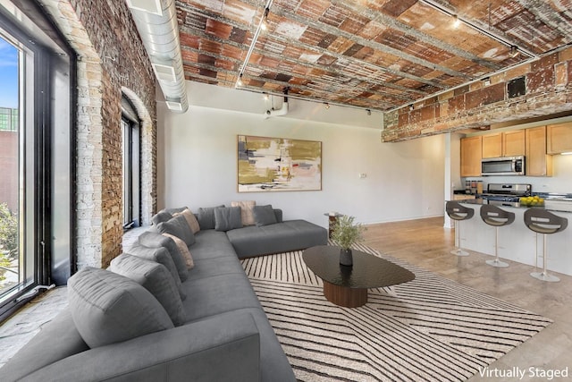 living room with brick wall and brick ceiling