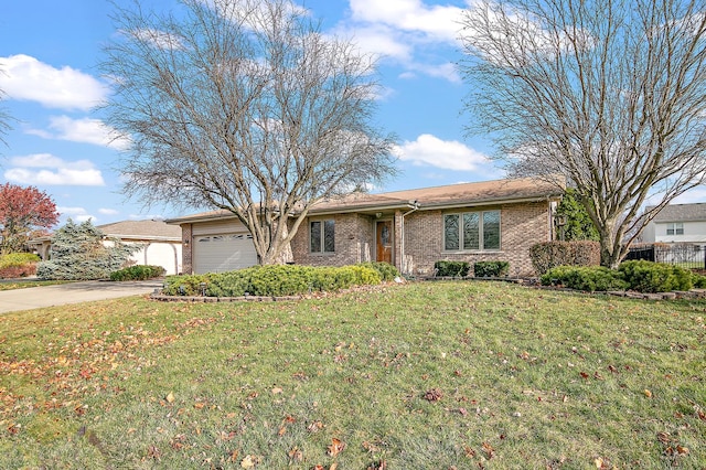 ranch-style home featuring a front lawn and a garage