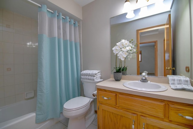 full bathroom featuring vanity, shower / bath combo with shower curtain, tile patterned floors, and toilet