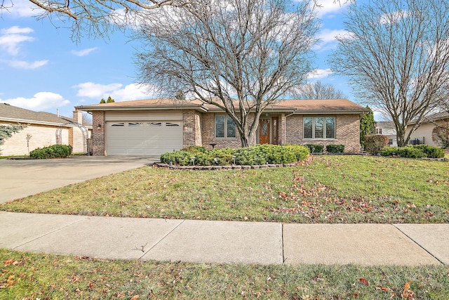 ranch-style home with a front lawn and a garage