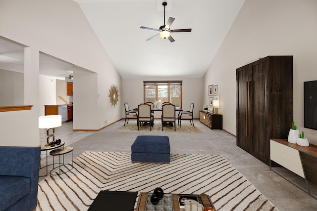 carpeted living room with high vaulted ceiling and ceiling fan