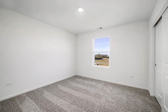 view of carpeted spare room