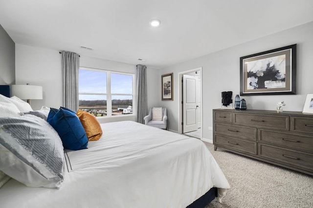 bedroom with light carpet