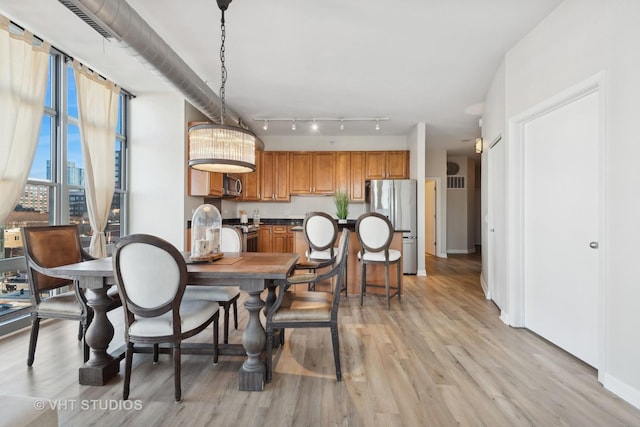 dining area featuring light hardwood / wood-style flooring