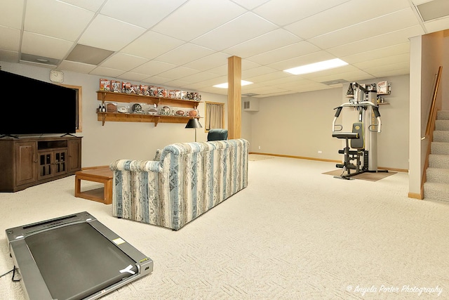 exercise area featuring a drop ceiling and carpet