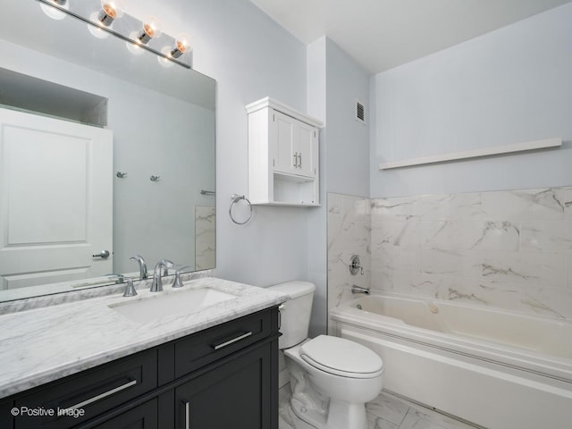 bathroom with vanity, toilet, and a bathing tub