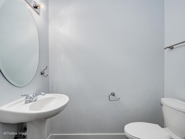 bathroom with sink and toilet