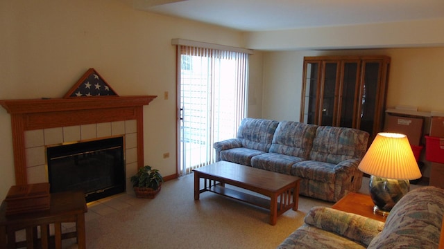 living room featuring light colored carpet and a tile fireplace