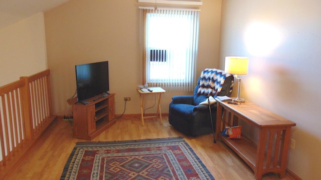 sitting room with light wood-style floors and baseboards