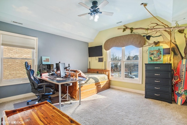 bedroom with multiple windows, lofted ceiling, and carpet flooring