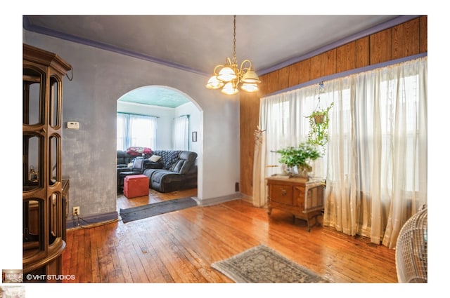 dining space featuring an inviting chandelier and hardwood / wood-style floors