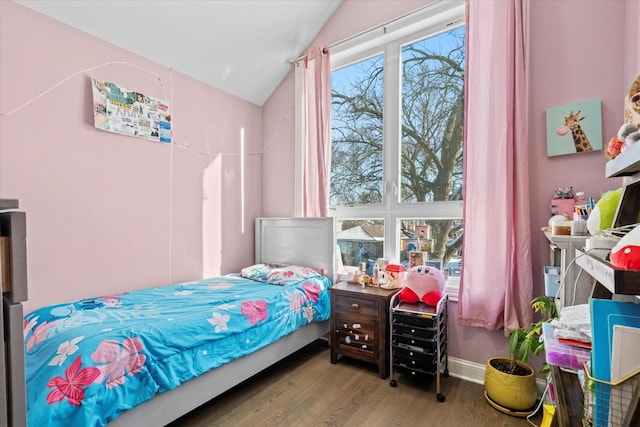 bedroom with hardwood / wood-style floors and vaulted ceiling