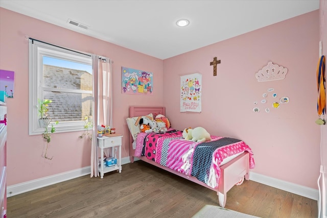 bedroom featuring dark hardwood / wood-style flooring