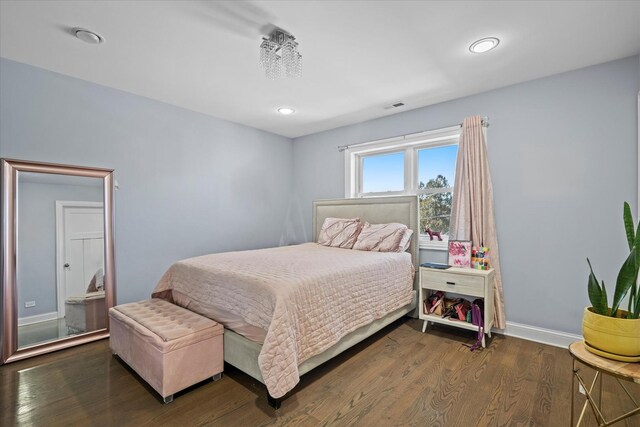 bedroom featuring dark hardwood / wood-style floors