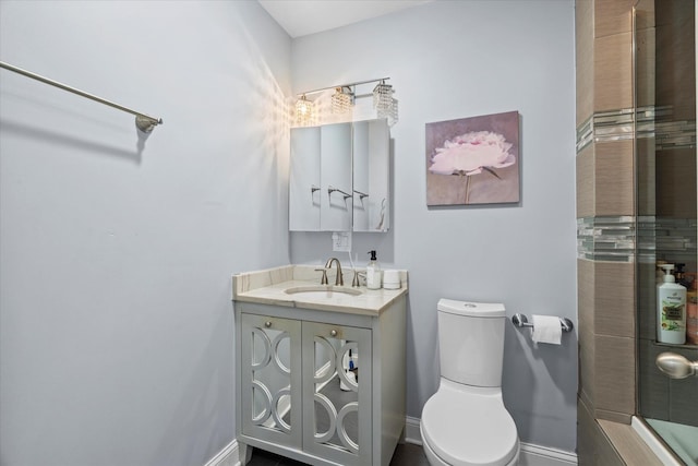 bathroom with toilet and vanity