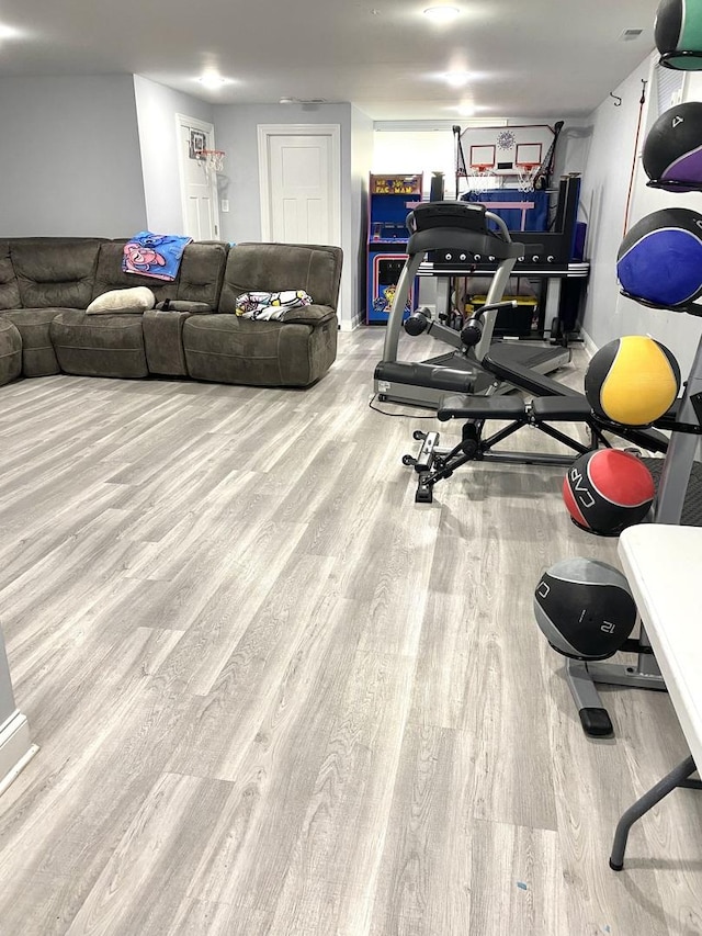 exercise area with light wood-type flooring