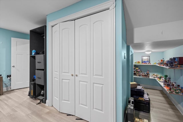 bedroom featuring light hardwood / wood-style flooring and a closet